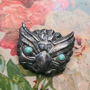 Vintage/ antique owl pin with glowing blue eyes!